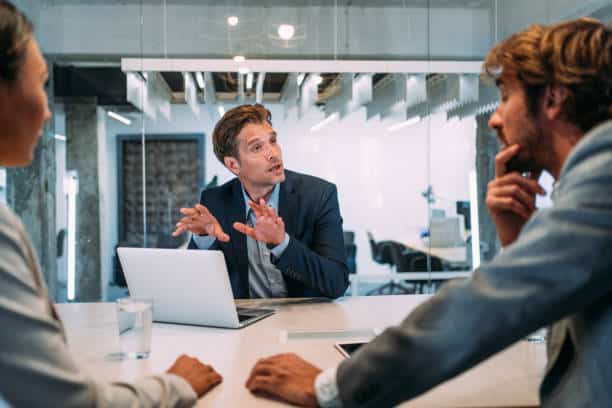 istockphoto-1362265062-612×612 Shot of young couple having a consultation with a financial advisor in the office. Group of business persons in business meeting. Three entrepreneurs on meeting in board room. Corporate business team on meeting in modern office. Male manager discussing new project with his colleagues. Company owner on a meeting with two of his employees in his office.